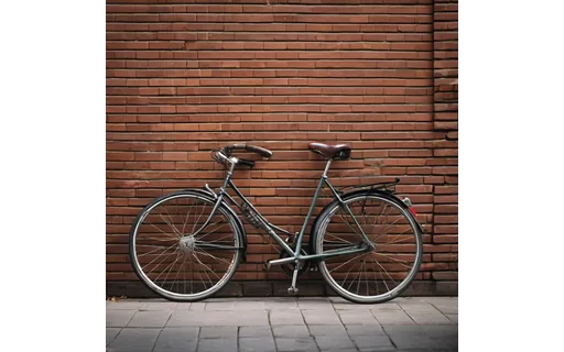 City bicycle leaning against a brick wall, soft daylight